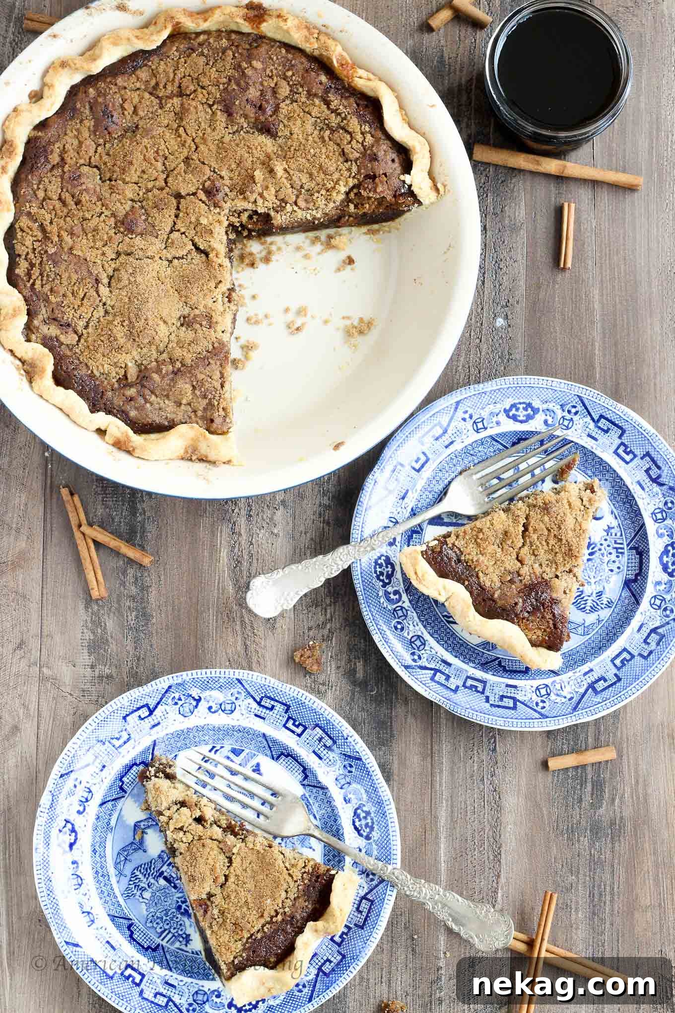 Old-Fashioned Molasses Crumble 2 A stunning slice of Shoofly Pie revealing its rich molasses filling and buttery streusel topping, set against a rustic background.