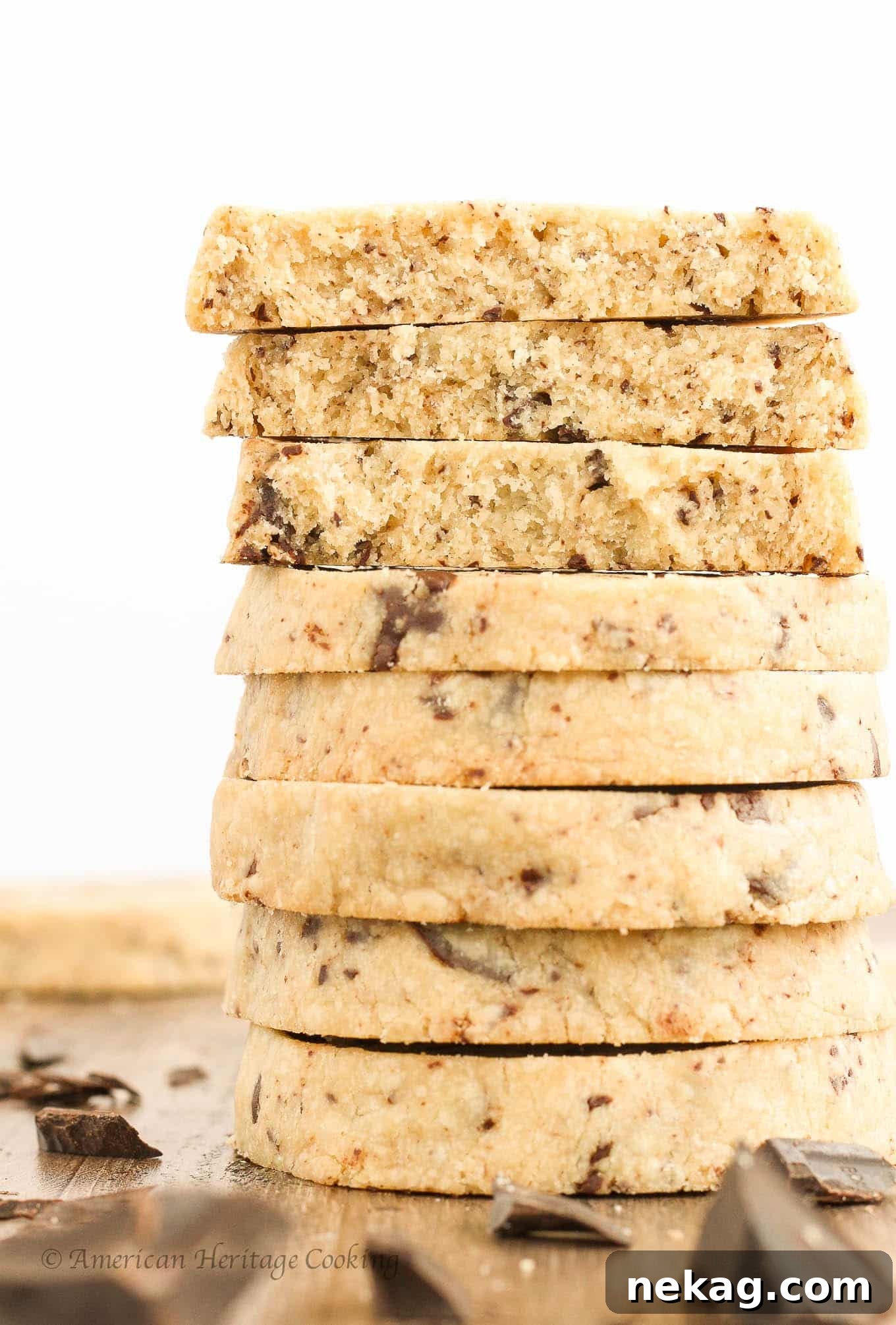 Divine Chocolate Chip Shortbread 4 A perfectly stacked pile of freshly baked chocolate chip shortbread cookies, showcasing their inviting texture and generous chocolate chunks.