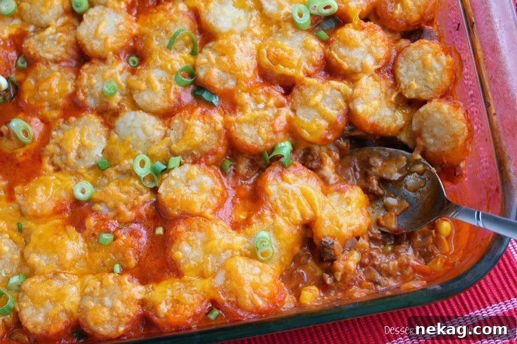 Close-up of savory Sloppy Joe meat mixture with bell peppers and onions in a skillet