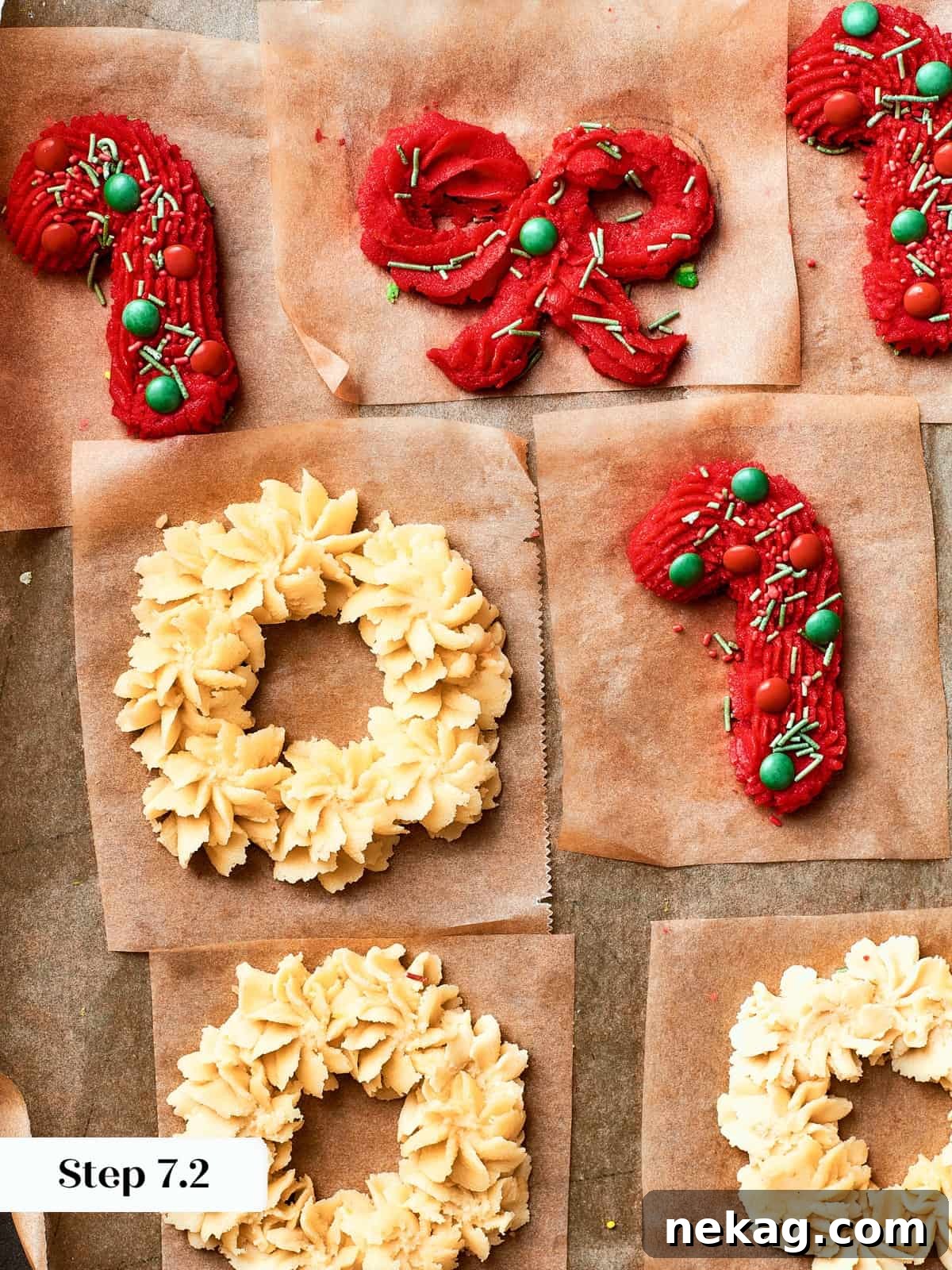 Unbaked cookie dough piped into charming festive designs like candy canes, bows, and wreaths, waiting to be transformed into spritz cookies.