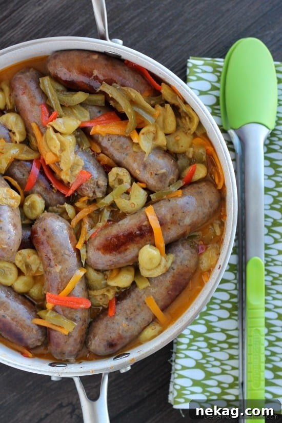 Grape Glazed Italian Sausage with Peppers 4 Vibrant orange-hued glaze coating Italian Sausages with Peppers and Grapes
