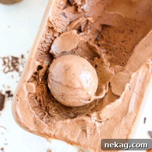 Double Chocolate Caramel Ice Cream in glass container, freshly scooped, showcasing its rich texture.