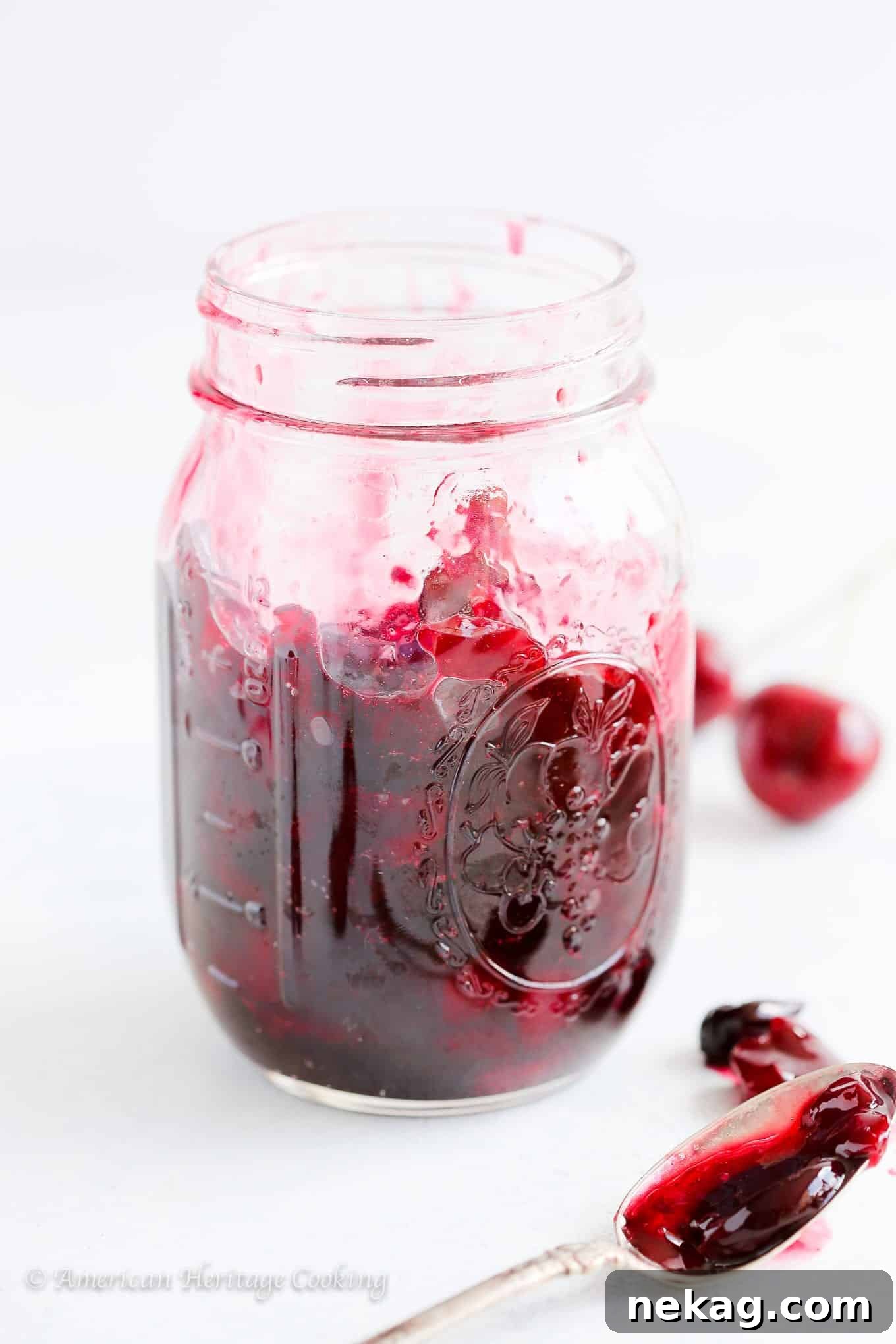 Effortless Homemade Cherry Preserves 2 Homemade cherry preserves glistening in a jar, ready to be enjoyed.
