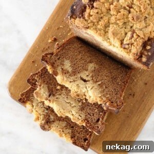 Banana Crumb Bread sliced on wooden board