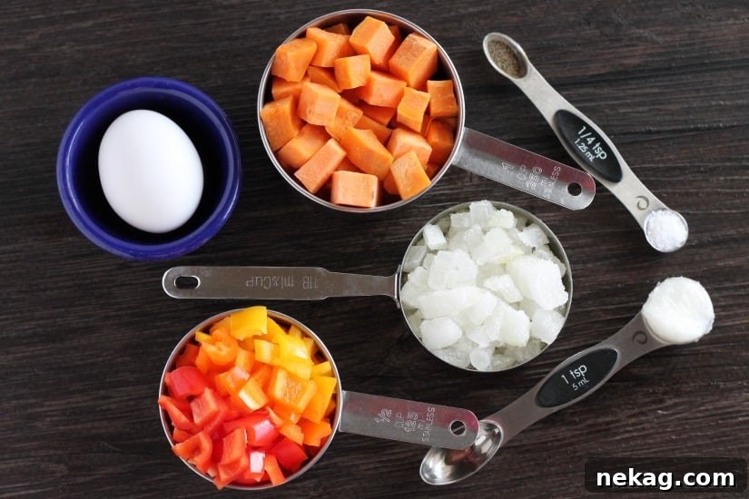 Close-up view of Sweet Potato Hash simmering in a skillet, showcasing the tender vegetables