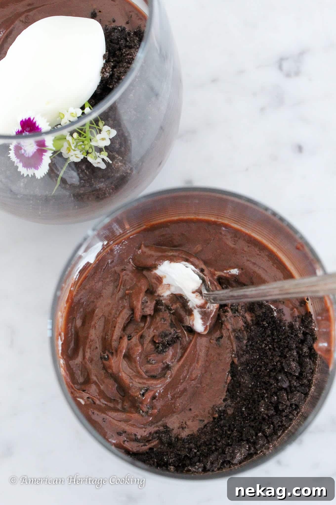 Rich Velvety Chocolate Pudding 2 Rich, dark chocolate pudding elegantly served in a clear glass cup.