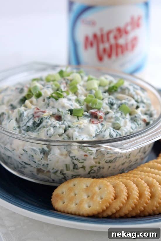 Close-up of MIRACLE WHIP Creamy Spinach & Artichoke Dip in a bowl