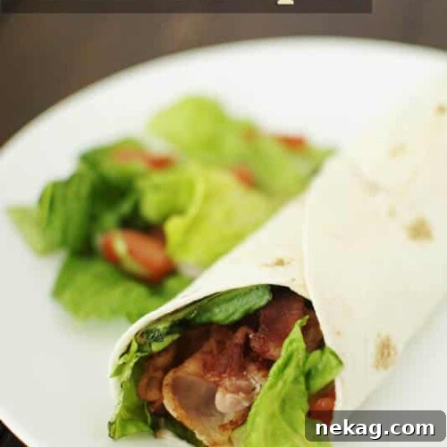Close-up of a freshly prepared BLT Wrap, showing the vibrant ingredients