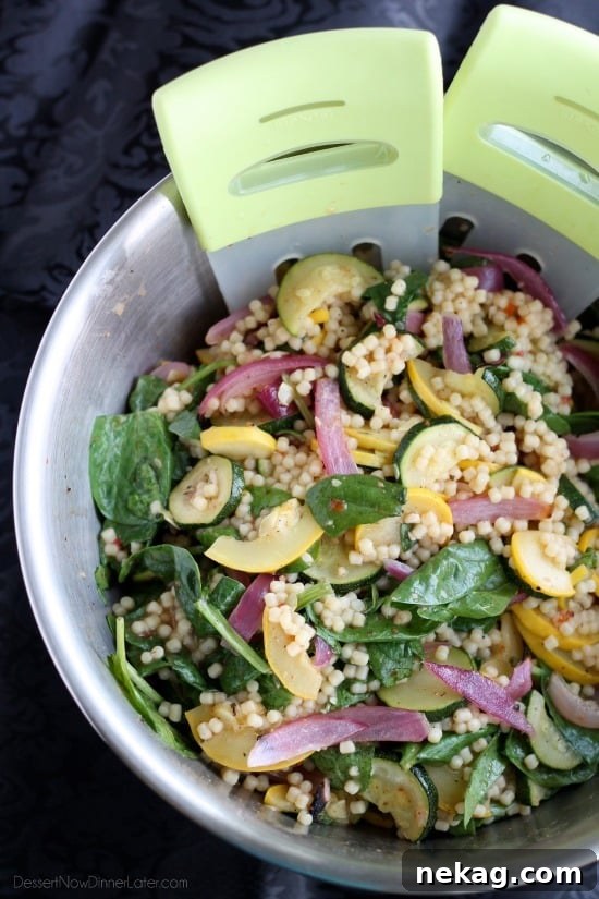 Roasted Garden Pasta Salad 3 Close-up of roasted zucchini, yellow squash, and red onion, glistening with olive oil and spices.