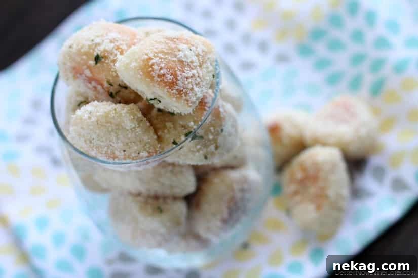 Sweet Cinnamon and Savory Garlic Parmesan Pretzel Bites 5 A platter of Garlic Parmesan Pretzel Bites, beautifully golden and seasoned, ideal for dipping.