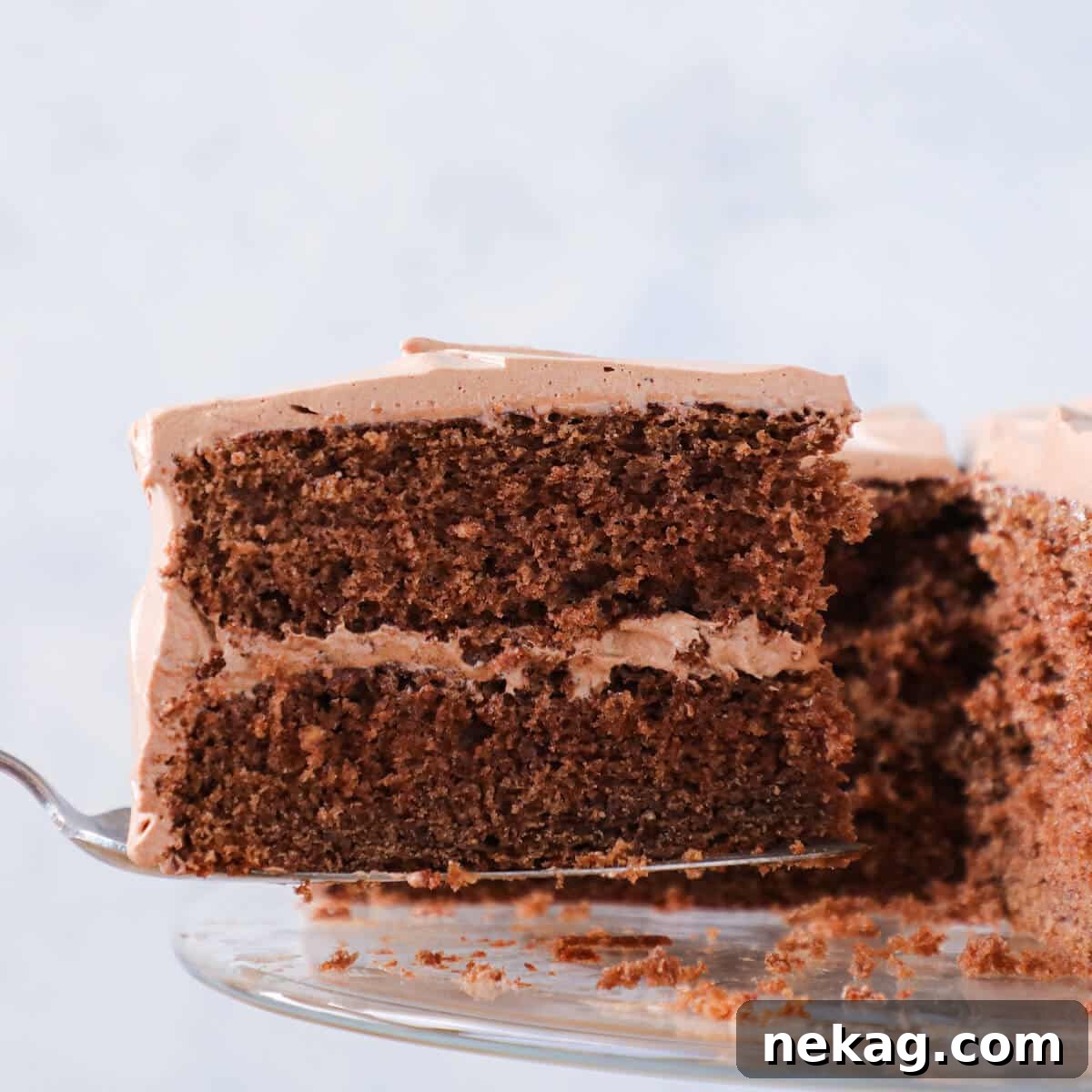 Sinful Chocolate Fudge Delight 4 Old Fashioned Chocolate Fudge Cake slice on cake server, ready to be enjoyed.
