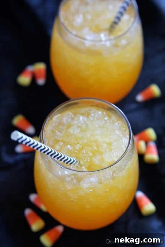 Autumn Candy Corn Brew 3 Close-up of a perfectly layered Candy Corn Punch with frosted glass and pebble ice, showing the distinct color separation