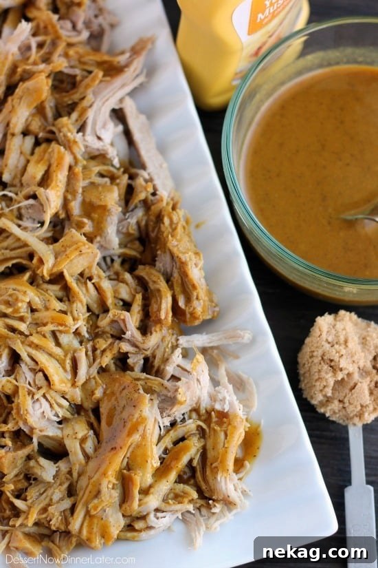 Carolina Gold Pulled Pork 3 Close-up of slow cooker pulled pork ready to be shredded