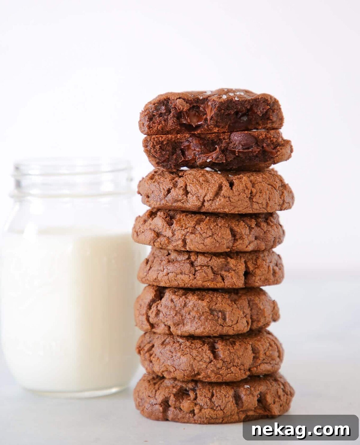 Easy chocolate desserts like these double chocolate chip cookies broken to show gooey chocolate chips.