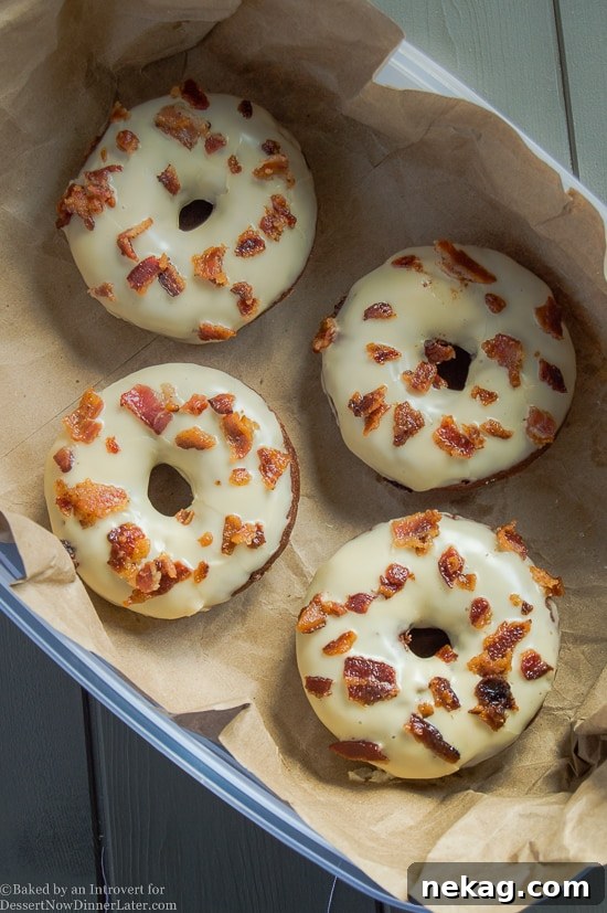 Close-up of baked maple bacon chocolate donuts cooling on a rack