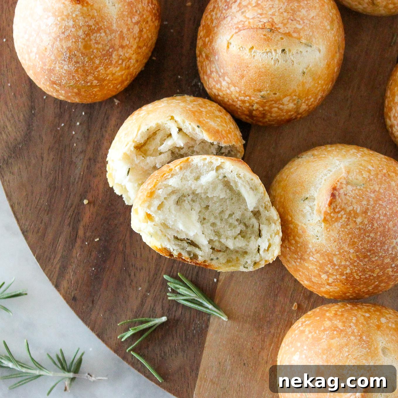 Artisan Sourdough Buns 2 Soft on the inside and crunchy on the outside Rosemary Sourdough Rolls, ready to be enjoyed.