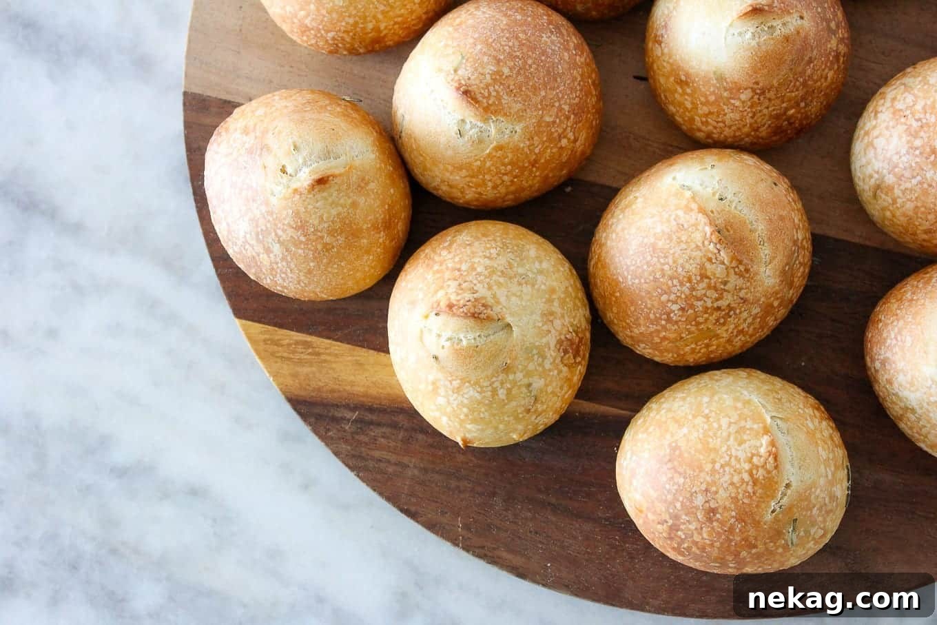 Artisan Sourdough Buns 4 Close-up of baked Rosemary Sourdough Rolls, showcasing their golden-brown, crispy crust.
