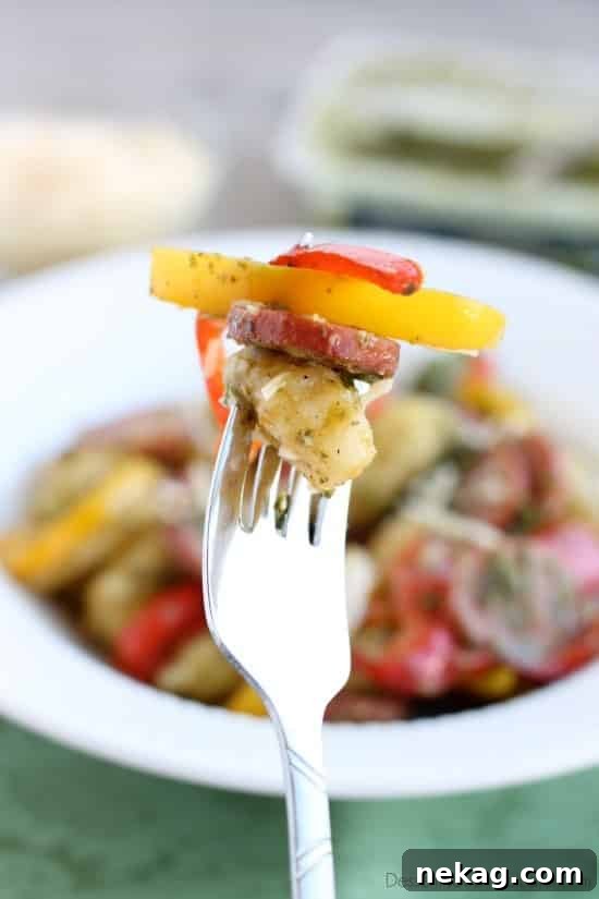 Ingredients for Pesto Gnocchi with Sausage and Peppers on a cutting board