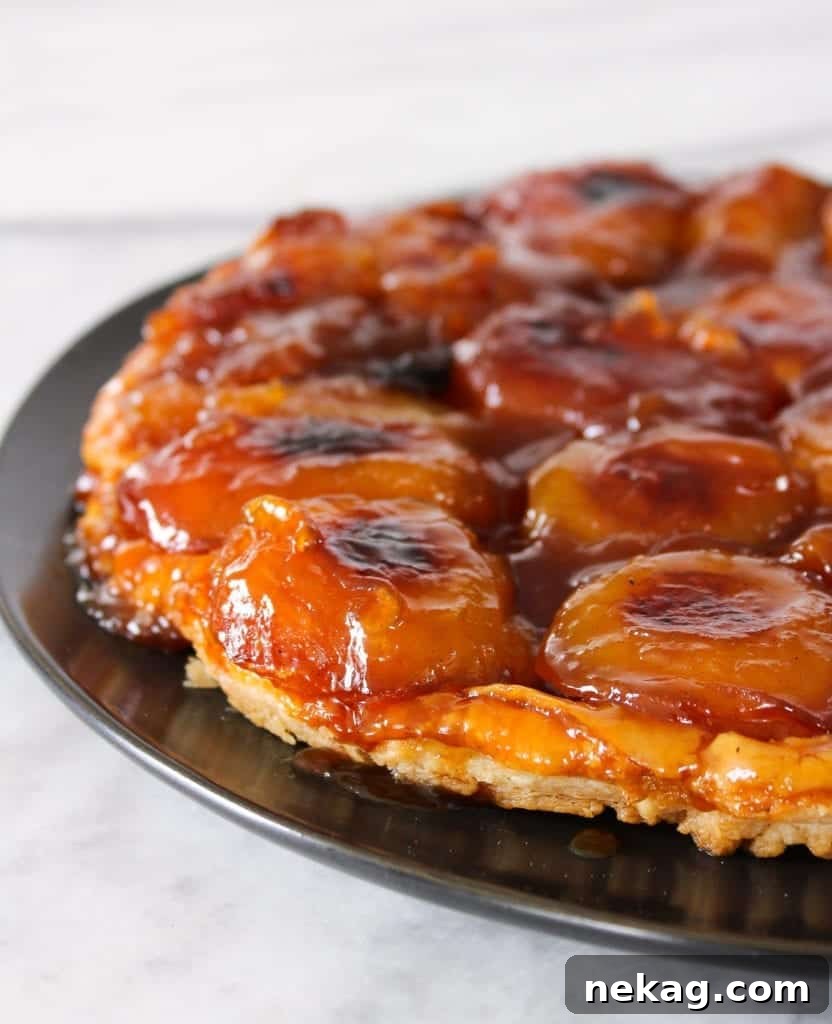 Golden Caramel Apple Delight 3 This Apple Tarte Tatin is what Francophile dreams are made of! It has buttery puff pastry cooked to perfection, deep caramelized apples, and is flambéed just because!