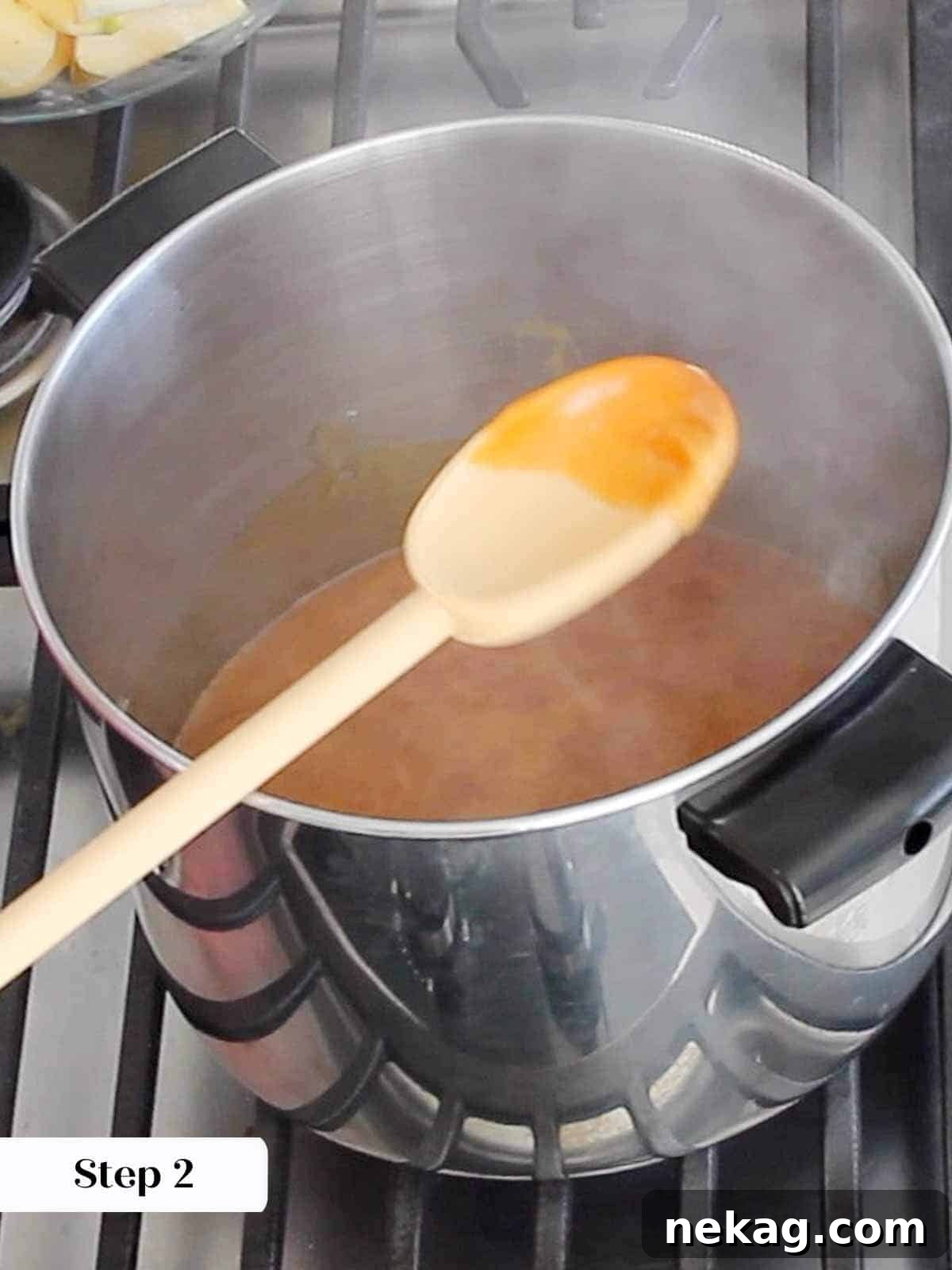 Granulated sugar being caramelized in a large pot on the stovetop.