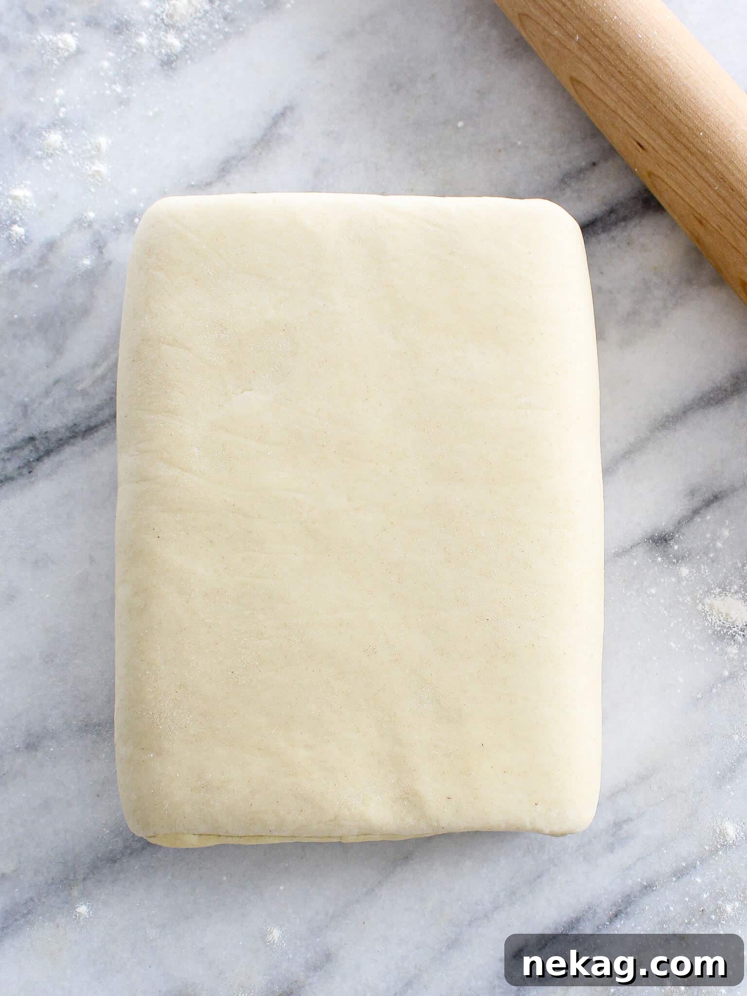 Quintessential Puff Pastry 2 Classic Puff Pastry with wooden rolling pin, ready to be rolled out