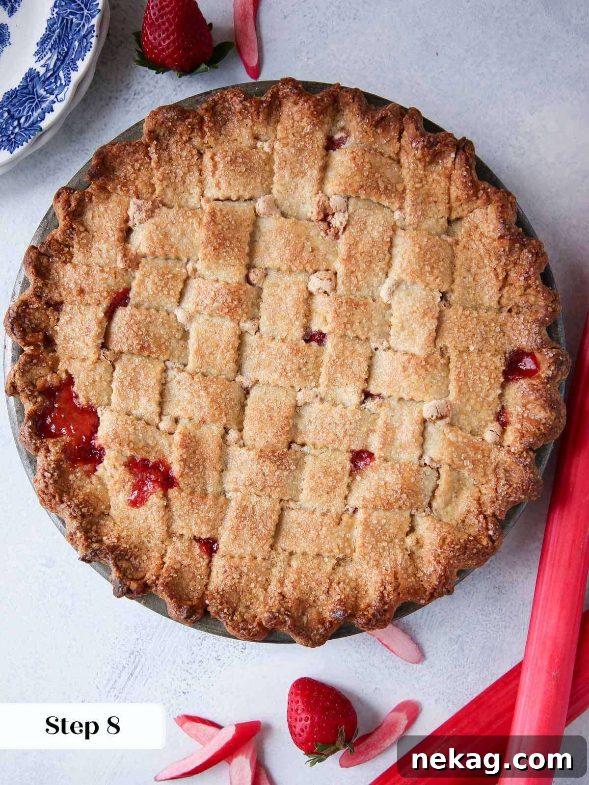 Strawberry Rhubarb Delight 7 A freshly baked strawberry rhubarb pie with a perfectly golden and crisp latticed crust, just removed from the oven and cooling.
