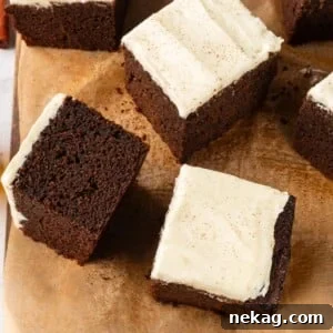 Multiple gingerbread cake slices arranged casually to highlight soft crumb and deep color.