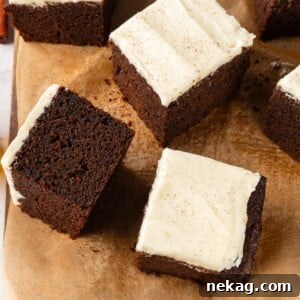 Multiple gingerbread cake slices arranged casually to highlight soft crumb and deep color.