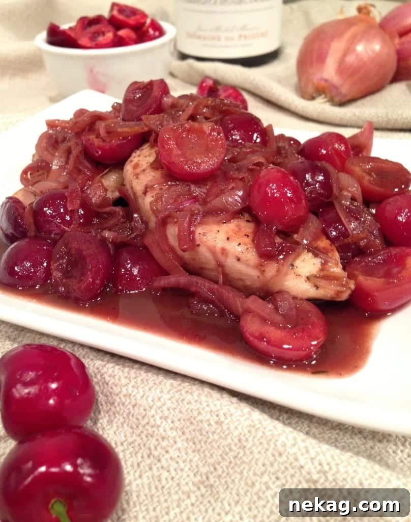 Cherry Wine Glazed Chicken 4 A close-up view of the luscious cherry wine sauce, rich in color and texture, with shallots and cherry halves visible.