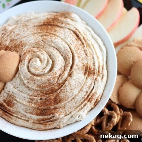 A beautifully presented bowl of Pumpkin Cheesecake Dip with dippers, showcasing the final, delectable product.