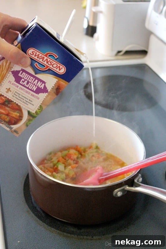 Spicy Southwestern Turkey Pot Pie 5 The rich and creamy Southwestern Turkey Pot Pie filling in a saucepan.