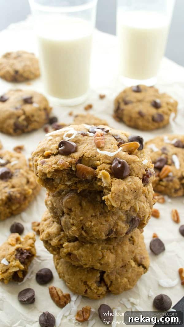 A stack of freshly baked Kitchen Sink Cookies, perfectly golden and soft.