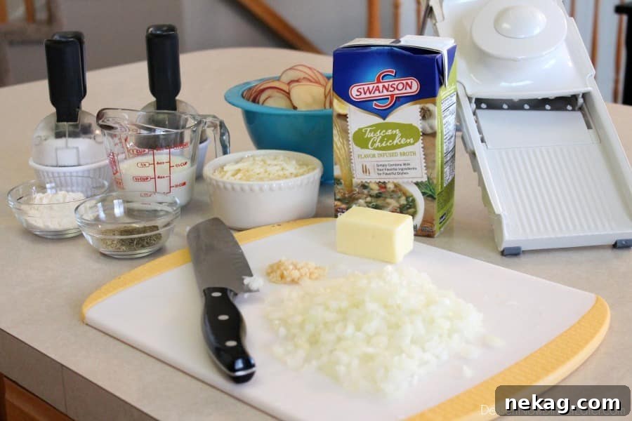 Ingredients laid out for Tuscan Scalloped Potatoes, including fresh red potatoes, butter, onion, garlic, flour, Swanson Tuscan Chicken Broth, milk, and cheeses.