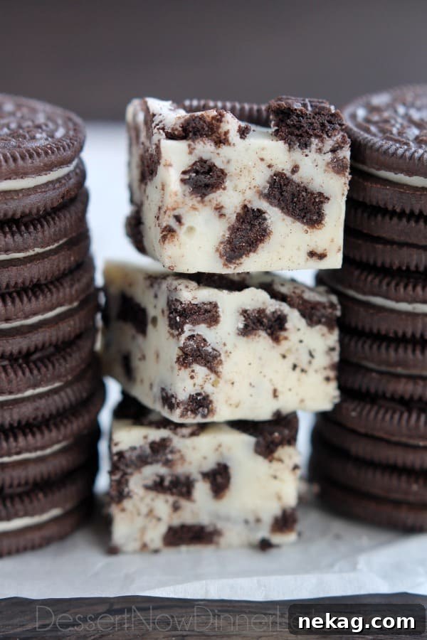 A festive plate filled with various homemade holiday treats, including easy Oreo fudge squares, ready to be shared with neighbors and loved ones.
