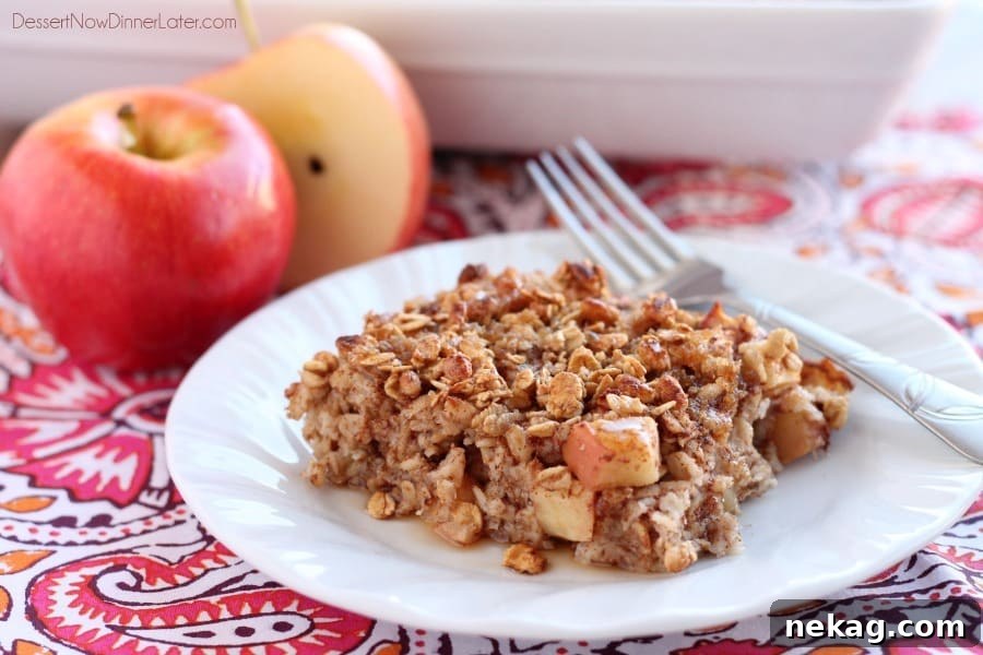 Cozy Apple Cinnamon Oatmeal Bake 4 Sliced Apple Cinnamon Baked Oatmeal with a crunchy granola topping. A perfect balance of soft and crunchy textures. From DessertNowDinnerLater.com