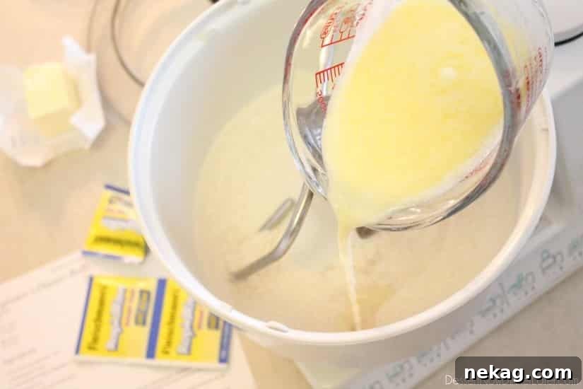 Milk, water, and butter mixture in a measuring cup after microwaving