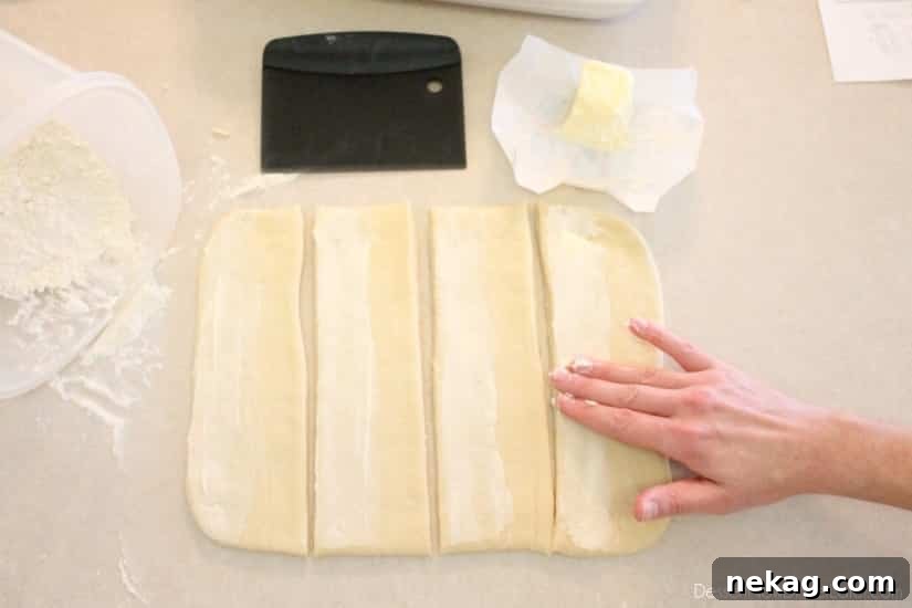 Dough strips with softened butter applied to one half