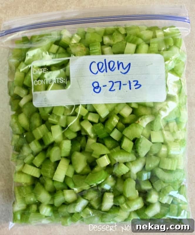 Fresh Frozen Staples 4 A labeled zip-top bag filled with frozen diced celery, ready for storage in the freezer.
