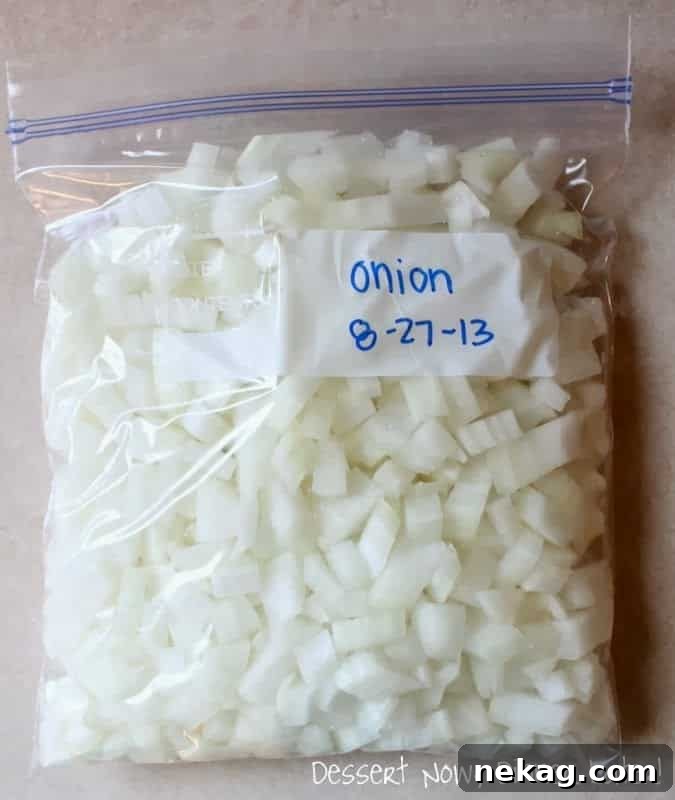 Fresh Frozen Staples 6 A labeled zip-top bag filled with frozen diced onion, with advice for double-bagging to contain odor.