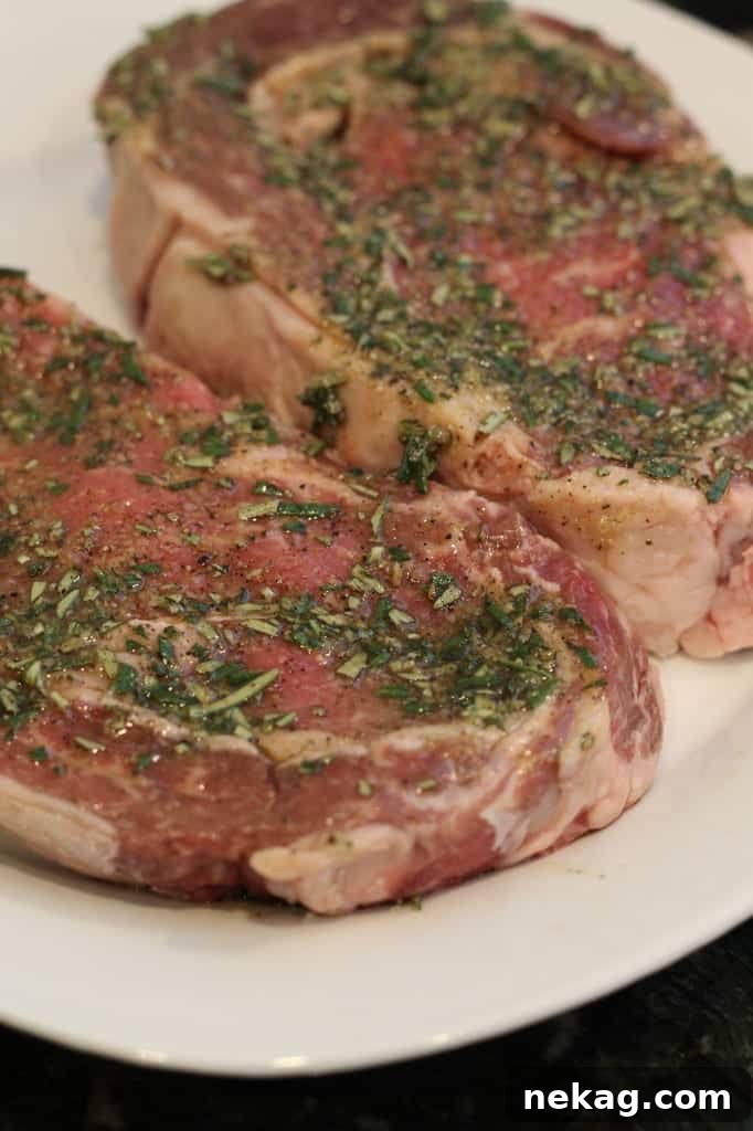 Essential ingredients for the rosemary rub: fresh rosemary sprigs, olive oil, and various spices.