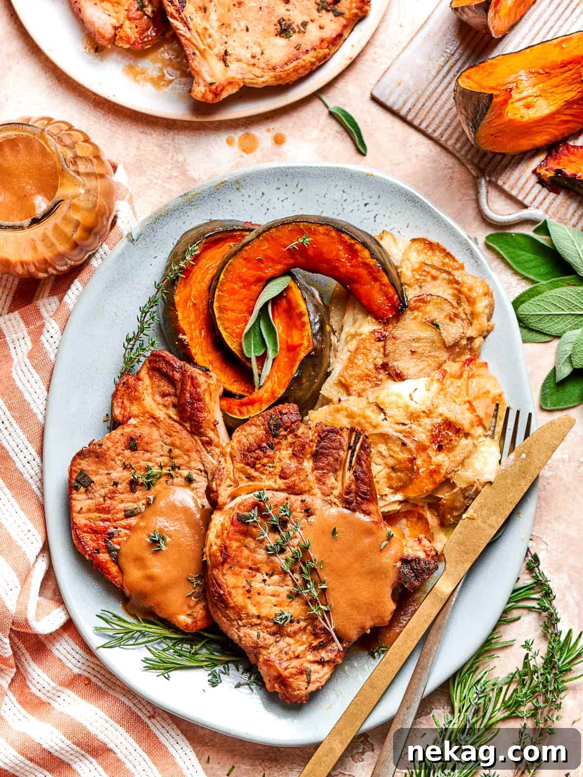Pork chop served on a plate with fork and knife ready for dinner.
