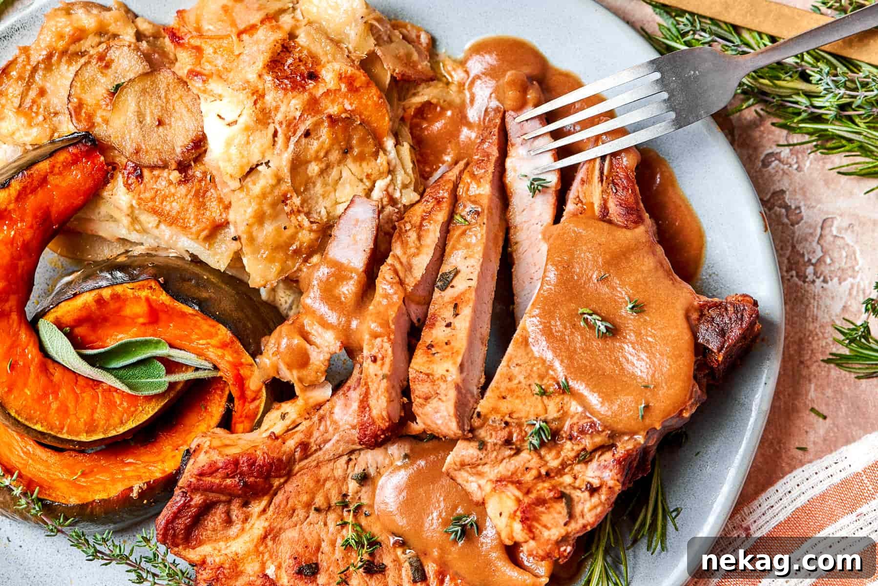 Pan-seared pork chop paired with warm applesauce sauce for dinner.