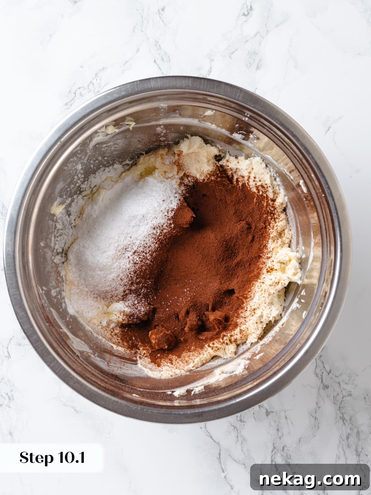 Sifted cocoa powder and powdered sugar added to butter and cream cheese mixture for smooth chocolate frosting.