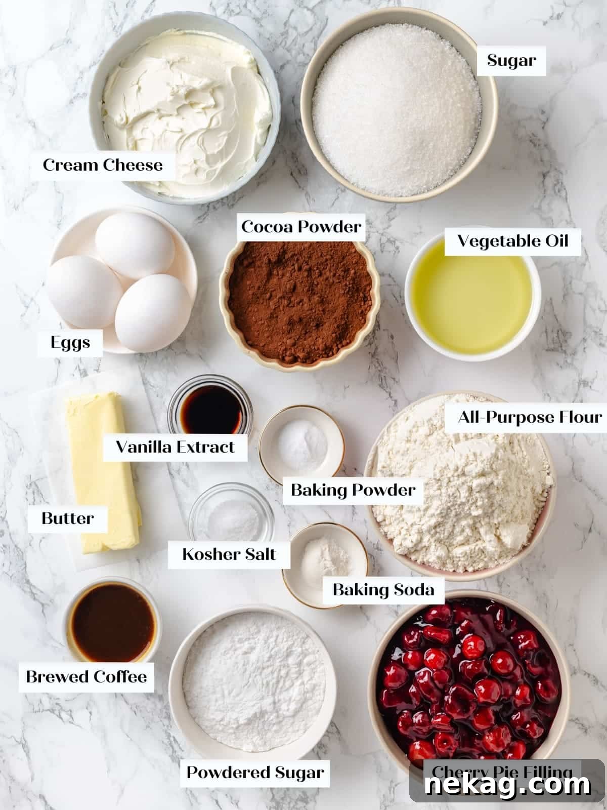 Measured chocolate cherry cake ingredients arranged neatly on kitchen countertop, ready for baking.