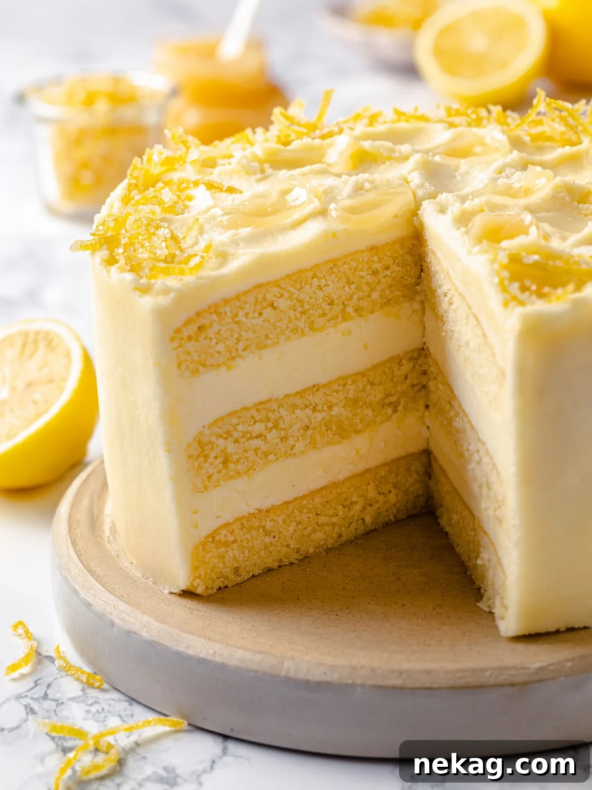Zesty Lemon Delight Cake 2 Cut lemon cake showing structured layers, smooth frosting, and moist crumb inside.