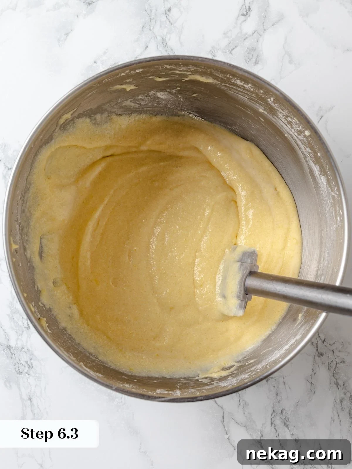 Zesty Lemon Delight Cake 13 Finished lemon cake batter smooth, pale, and ready for baking.