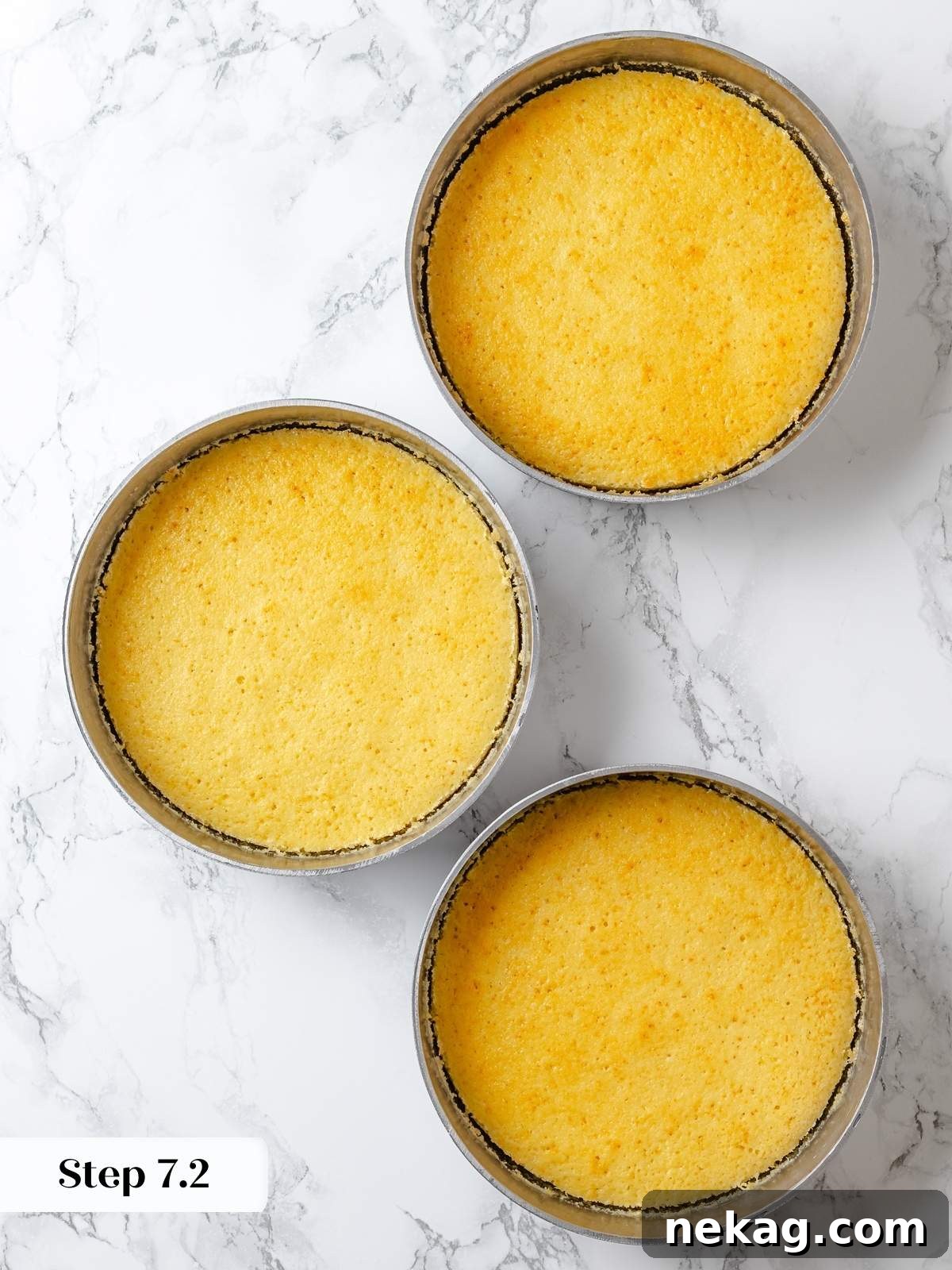 Zesty Lemon Delight Cake 15 Three baked lemon cake layers cooling evenly in round cake pans.