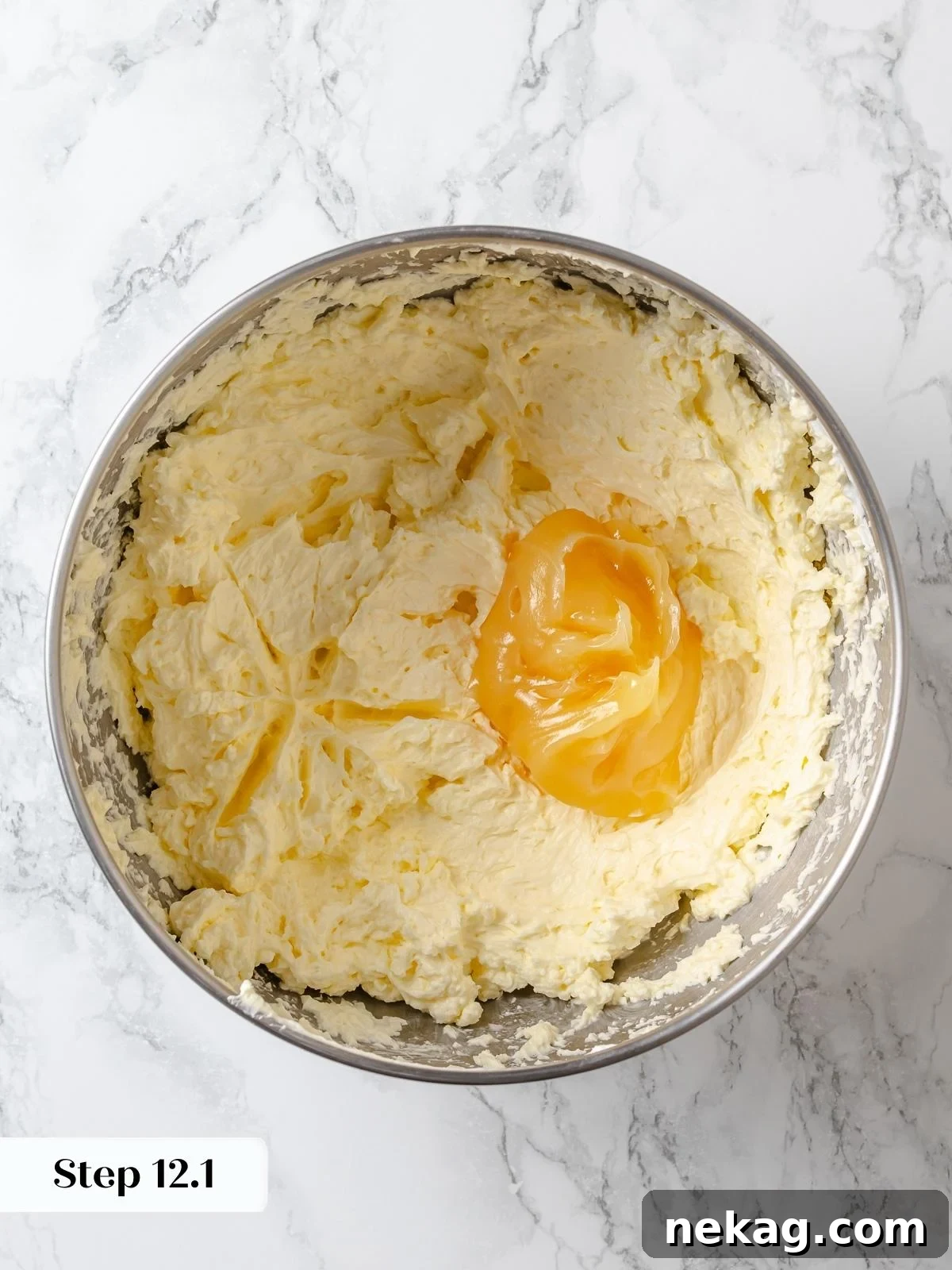 Zesty Lemon Delight Cake 21 Adding lemon curd to buttercream to enhance flavor without breaking texture.
