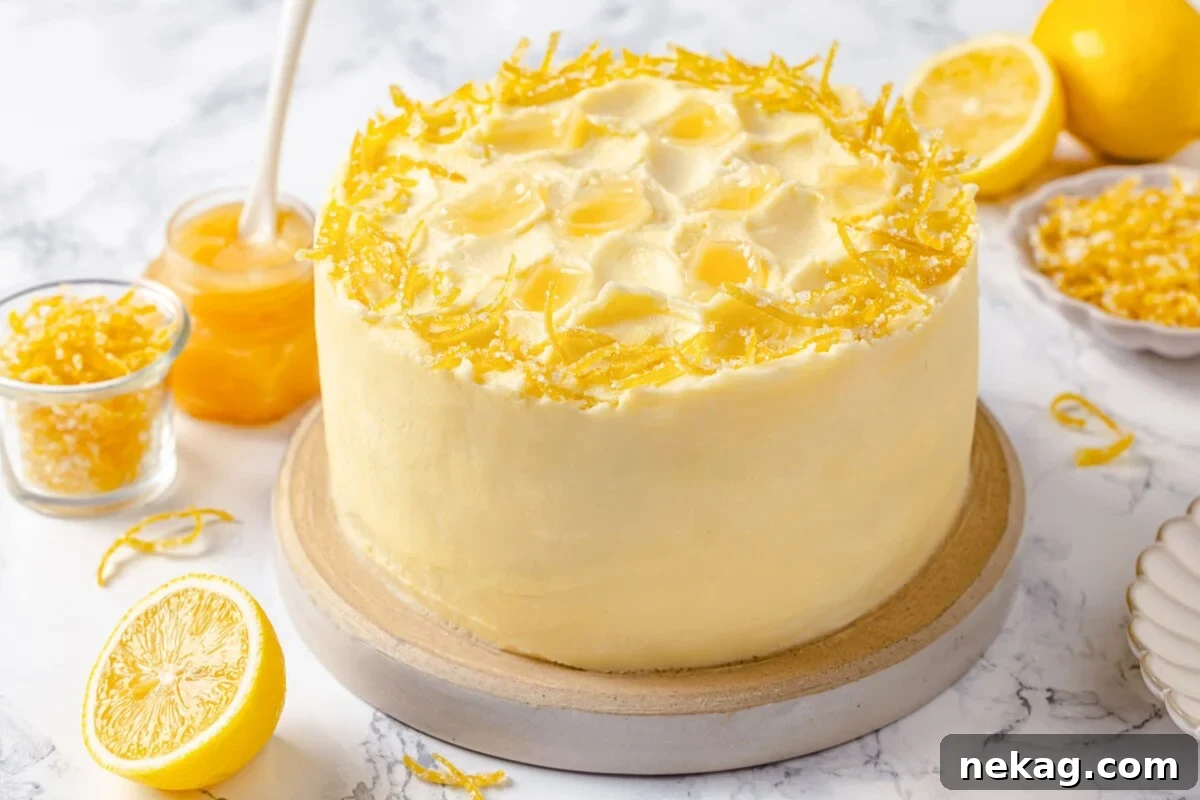 Zesty Lemon Delight Cake 5 Lemon cake decorated with curls of lemon peel and soft buttercream swirls.