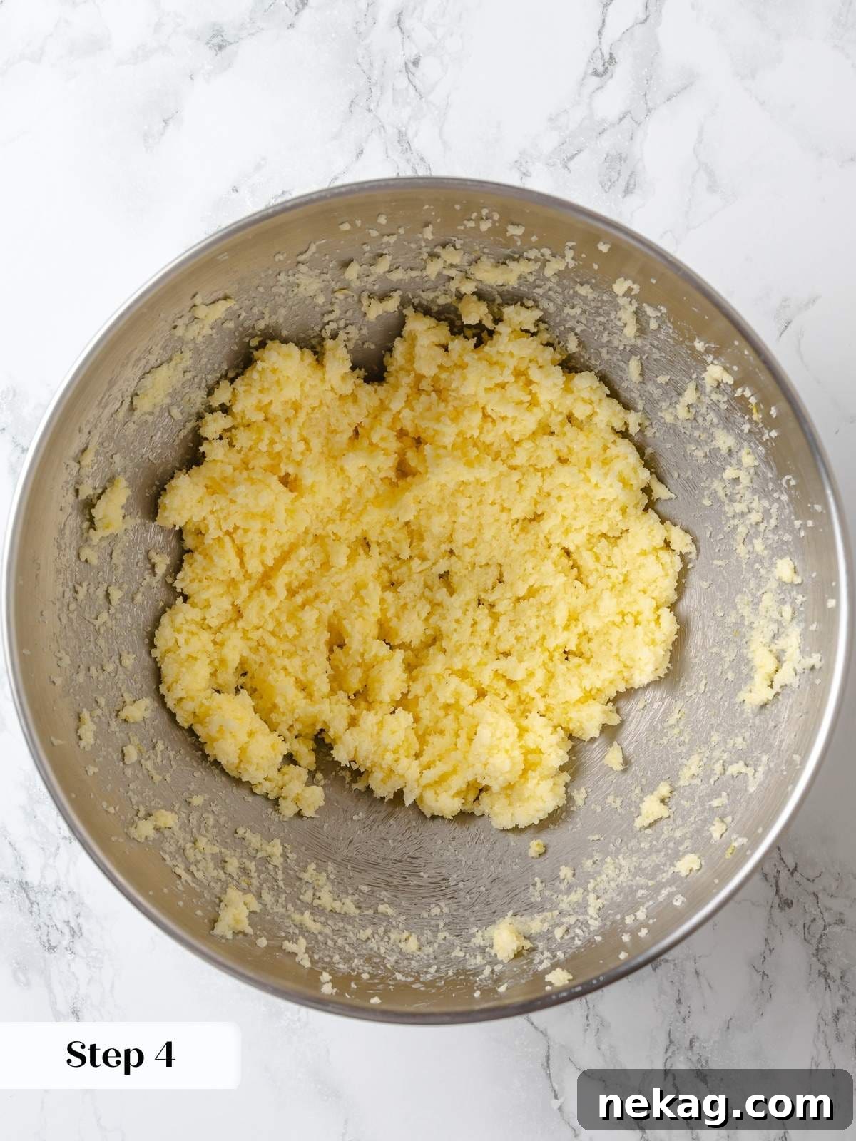Zesty Lemon Delight Cake 8 Creaming butter with citrus-infused sugar to build structure for lemon cake.